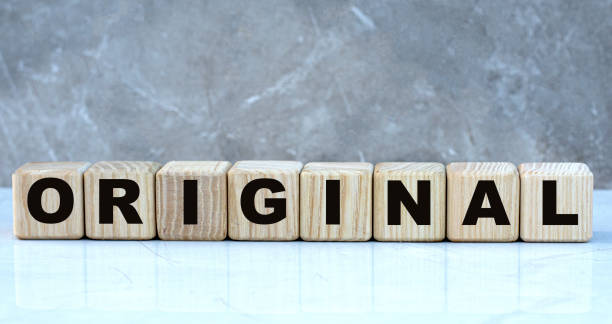 istock concept word original on cubes on a beautiful gray background 1207894987