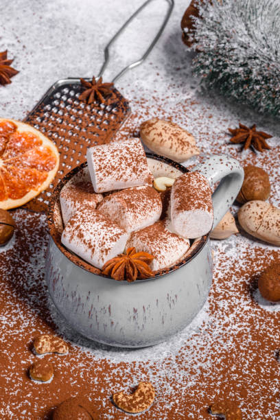 istock Mug of hot chocolate with white marshmallows on concrete background 1207895457