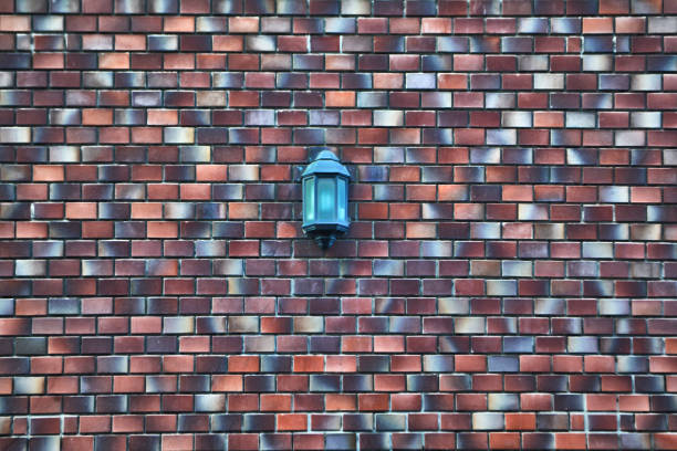 istock vintage lamp on colorful wall texture abstract  background 1207897281