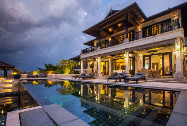 istock Luxury villa with big swimming pool interior outdoor 1207898319