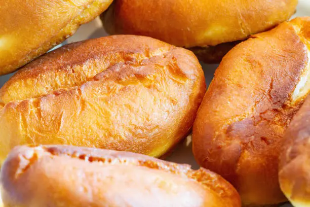 Photo of Fried homemade pies. Closeup, selective focus