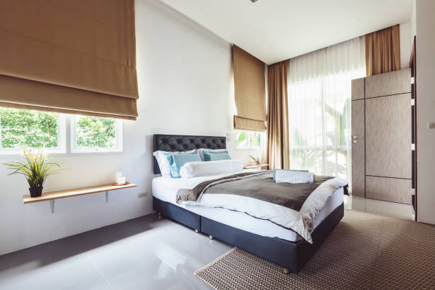 istock Modern bed room interior in Luxury villa. Big window 1207906247