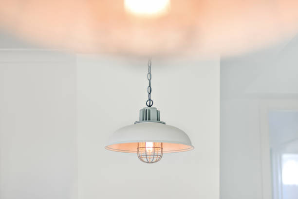 istock Light bulb flashing and hanging with a cover 1207908901