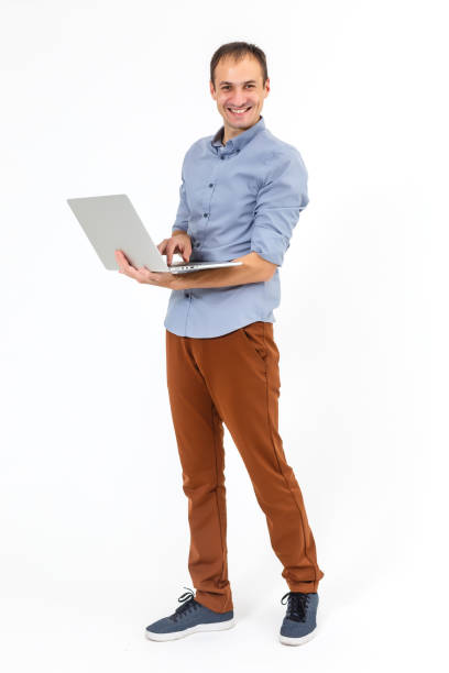 istock man working with laptop. Over white background 1207911881