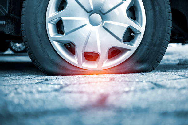 Car with flat tire Car with flat tire flat tire stock pictures, royalty-free photos & images