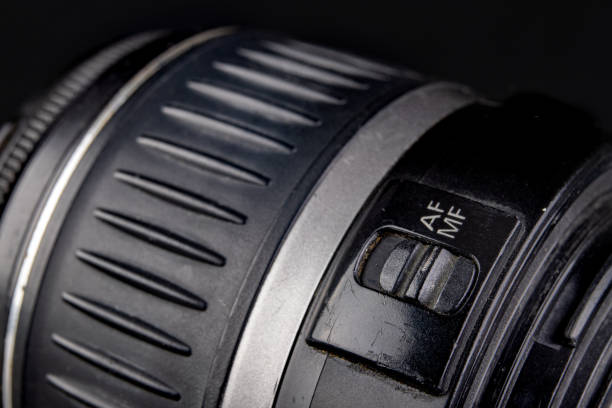 istock Slider for changing the autofocus mode. Buttons to change the lens mode. Dark background. 1207914382