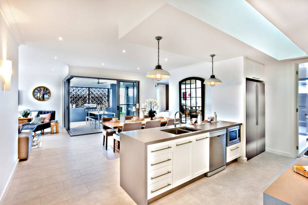 istock Modern kitchen with a dining room and patio area 1207914801