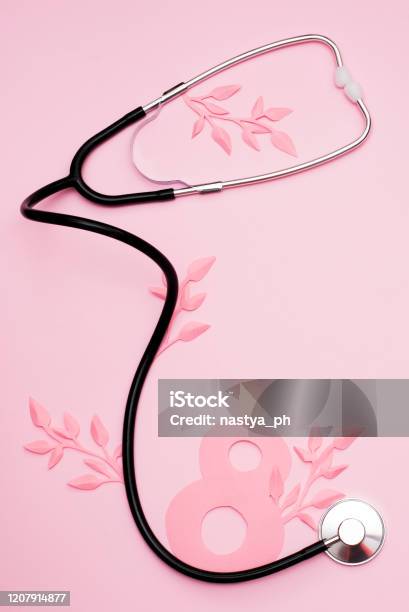 World Womens Day March 8th Stethoscope And Paper Leaves On Pink Background With Copy Space Stock Photo - Download Image Now