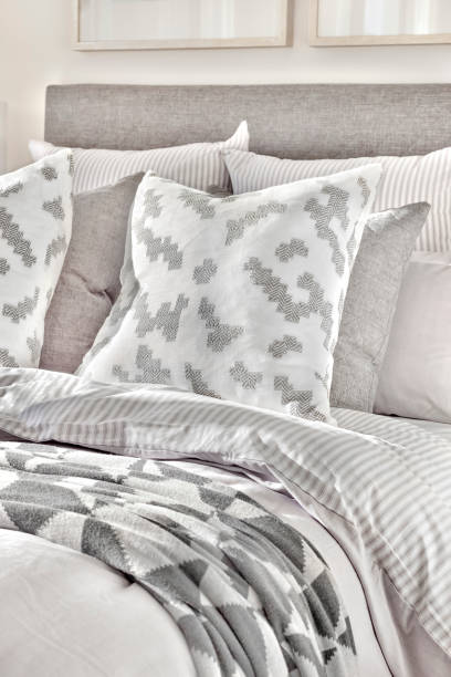 istock Modern bed and pillows with blankets close up 1207916211