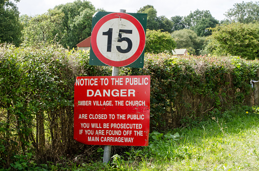 Warning sign in Imber village, Wiltshire.  The area is in the middle of the Salisbury Plain military training area and public access is restricted.