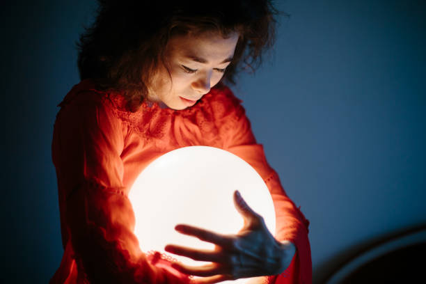 istock Young woman mixed race keep glowing ball lamp 1207916594