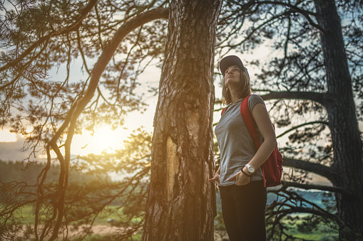 Young woman walking in the woods