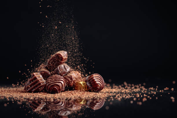 istock Chocolate candies on a black background . 1207918771