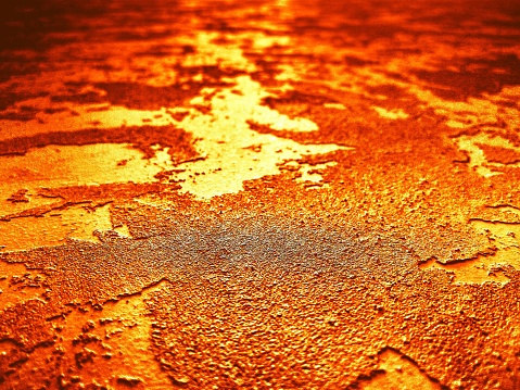 Red rust on a sheet of iron.  Macro shot.