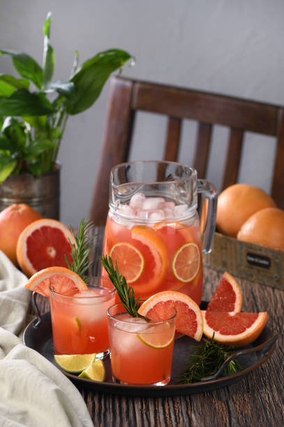 istock Fresh grapefruit cocktail. Fresh summer cocktail with grapefruit, lime, sprig of rosemary and ice cubes. 1207924392
