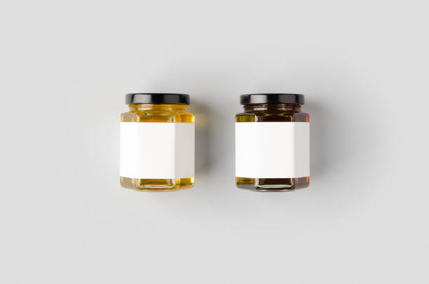 istock Hexagonal honey jars mockup with blank label. Two different colors. 1207925535
