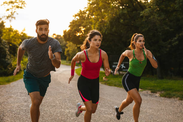 istock Group of young people competing in a race 1207926053