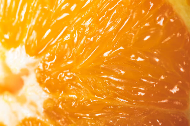 istock Fresh juicy orange macro detail background 1207926135