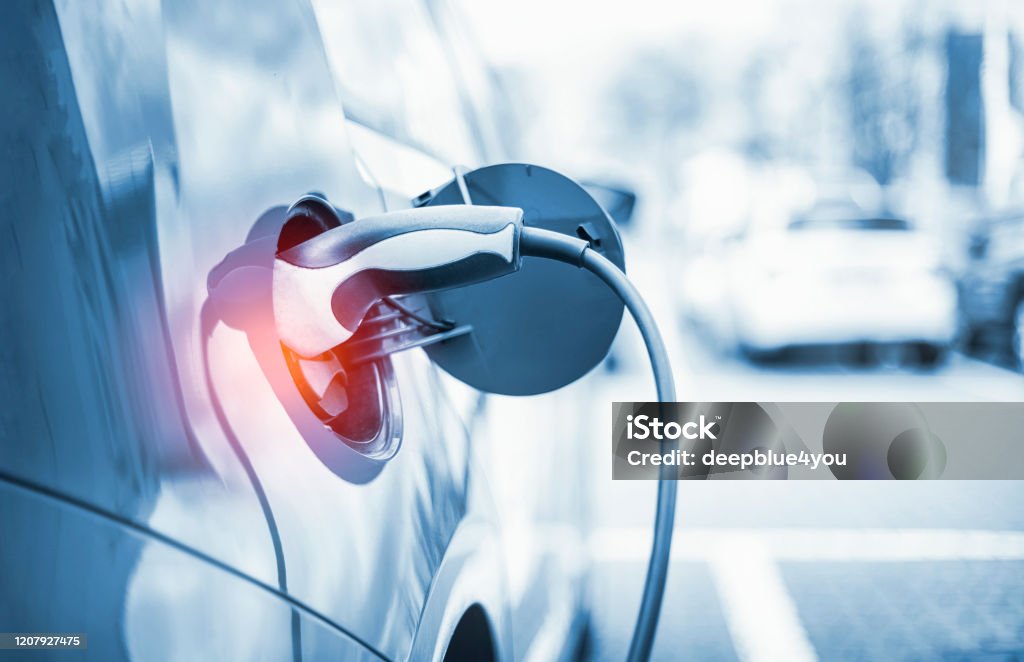 Electric Car Charging At Power Station Electric Car Stock Photo