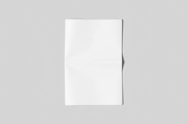 Blank newspaper mockup on a grey backgound.