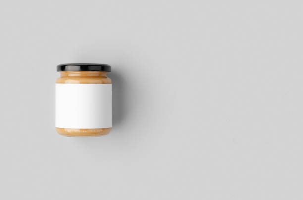 istock Peanut, almond, nut butter jar mockup with blank label. 1207928531