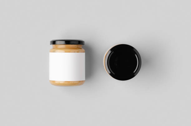 istock Peanut, almond, nut butter jar mockup with blank label. 1207929917