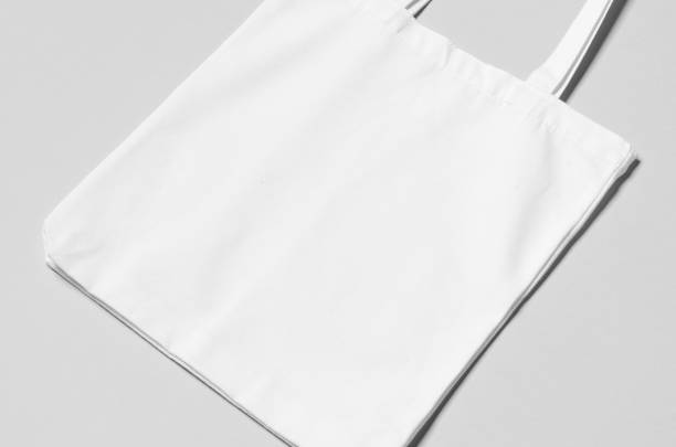 istock White tote bag mockup on a grey background. 1207930802