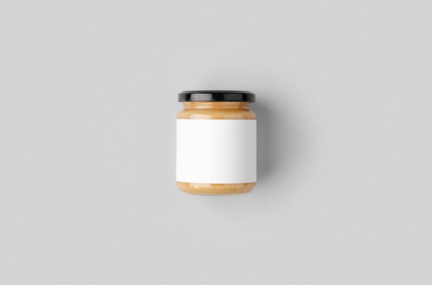 istock Peanut, almond, nut butter jar mockup with blank label. 1207930920