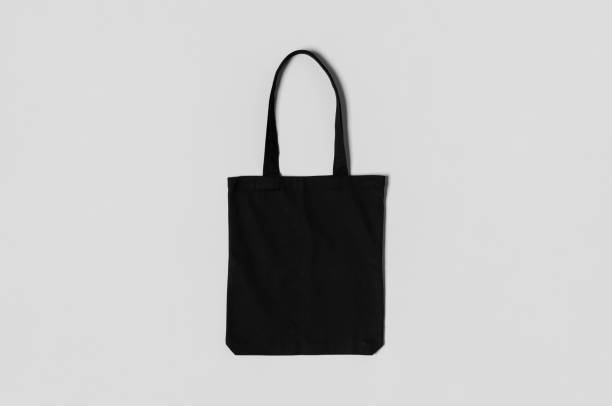 istock Black tote bag mockup on a grey background. 1207930952