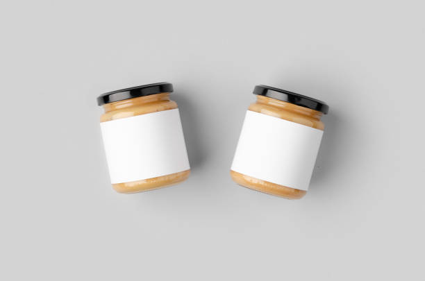 istock Peanut, almond, nut butter jar mockup with blank label. 1207930997