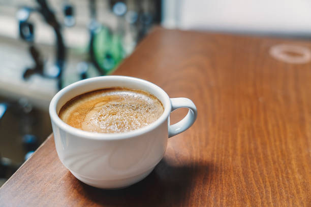 istock A cup of coffee on wooden table 1207931057