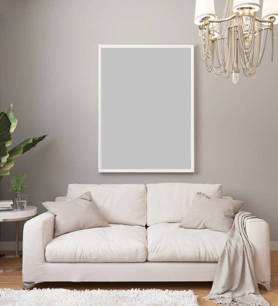 istock Poster mockup in white frame on light wall in classic luxury interior with chandelier and white sofa, plants. Modern light interior design with blanket picture. 3d rendering. 1207935528