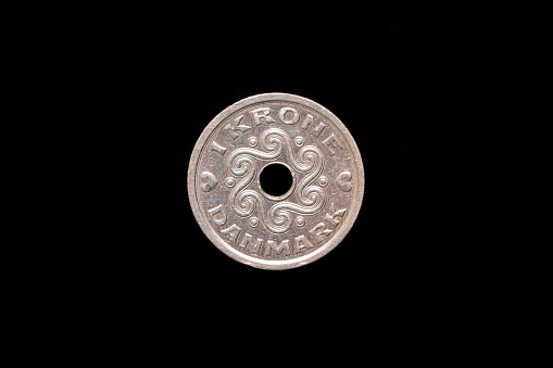 1 Danish Krone coin Queen Margrethe II from 1996, reverse. Isolated on black background