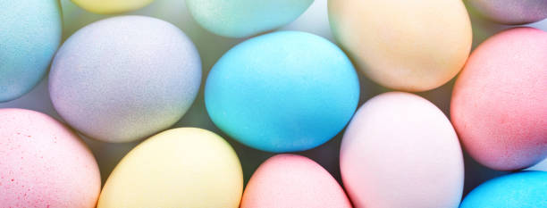 istock Colorful Easter eggs dyed by colored water with beautiful pattern on a pale blue background, design concept of holiday activity. 1207938357
