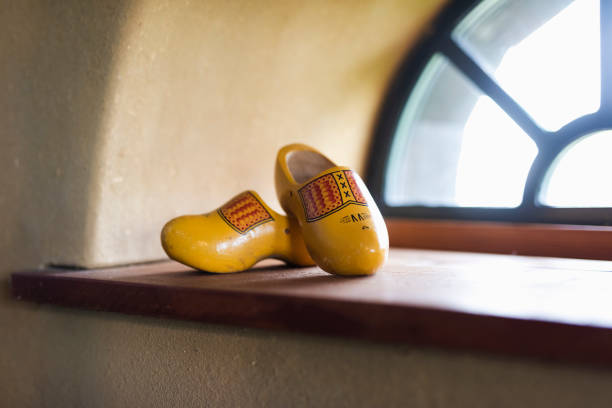 istock Two yellow nuggets for an old stable window with a yellow wall 1207939391