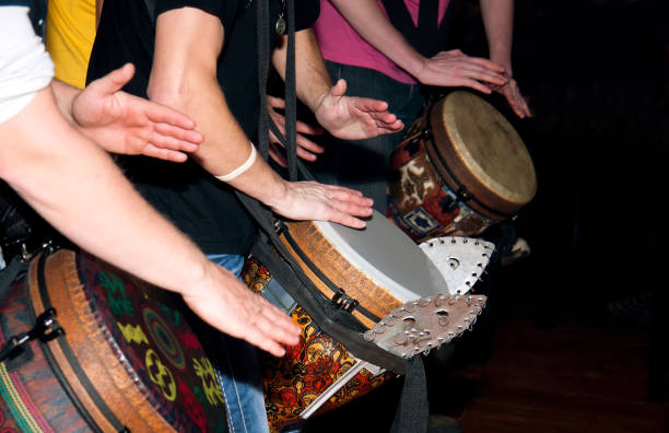 istock People hands playing on the ethnic drums 1207948175