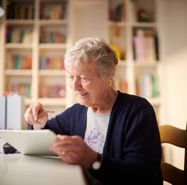 istock happy connected senior woman 1207950023