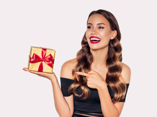 istock Beautiful woman with present 1207951380