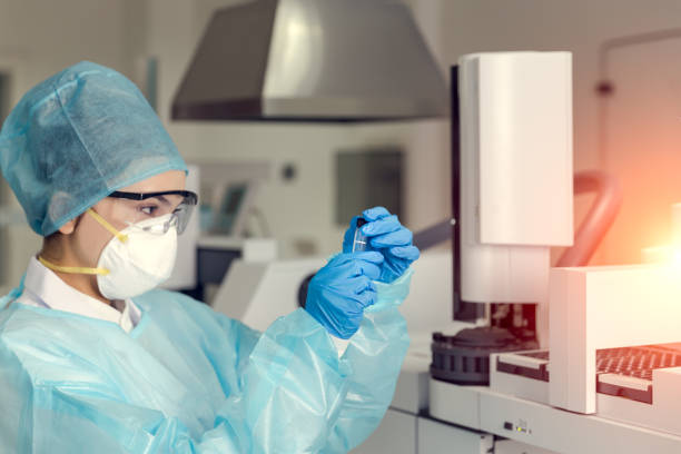 Female scientist looking at the scientific sample in the laboratory.
