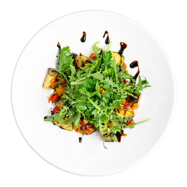 istock Fresh salad in a plate on a white background. The view from the top. 1207952107
