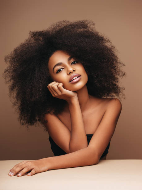 istock Beautiful smiling girl with curly hairstyle 1207955823
