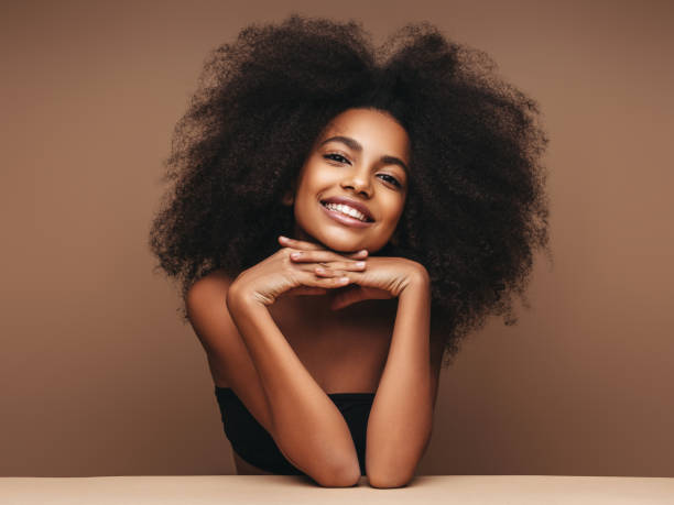 istock Beautiful smiling girl with curly hairstyle 1207955875