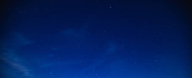istock Milky way stars on a dark night sky. 1207957072