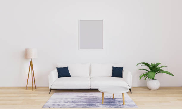 istock Empty frame for mockup. Bright living room with white sofa with dark blue pillows, white modern lamp, plant, coffee table. Furnished living room with white wall and wooden floor. 3d illustration. 1207957154