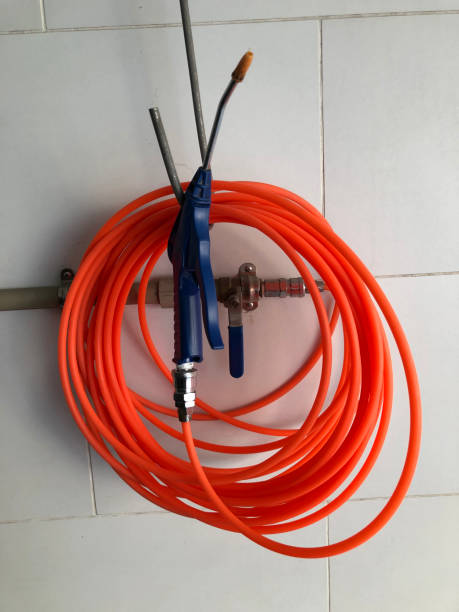 istock Close up on a orange water pipe tangled 1207962037