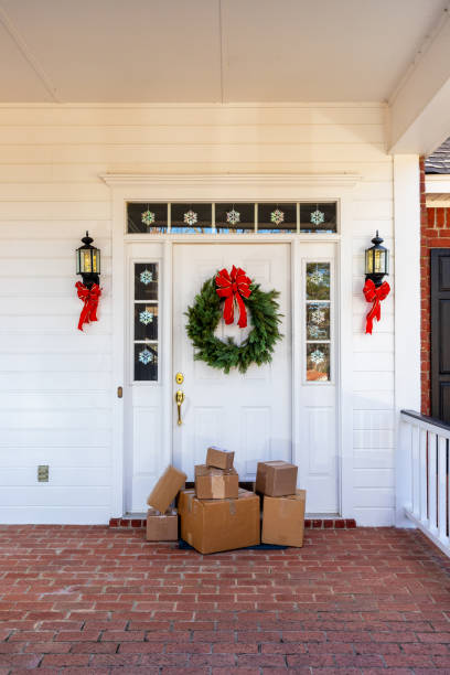 istock Mail Order packages on front porch during the holiday season 1207967166