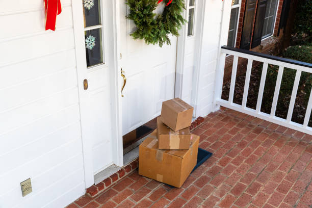 istock Mail Order packages on front porch during the holiday season 1207967168