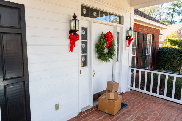 istock Mail Order packages on front porch during the holiday season 1207967879