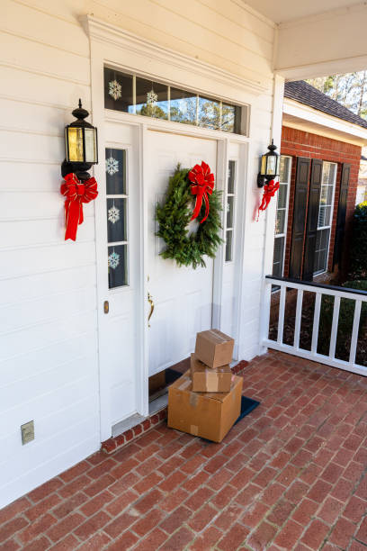 istock Mail Order packages on front porch during the holiday season 1207968024