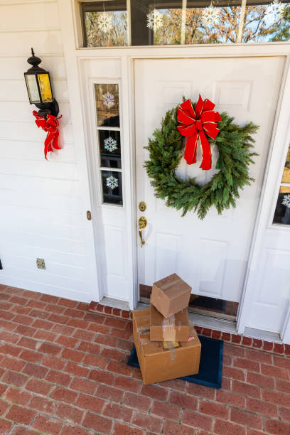 istock Mail Order packages on front porch during the holiday season 1207968063